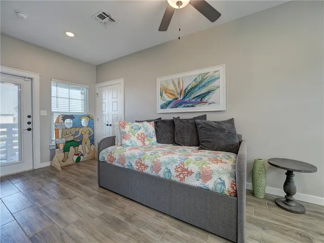 a kitchen with stainless steel appliances a stove a microwave and wooden floor