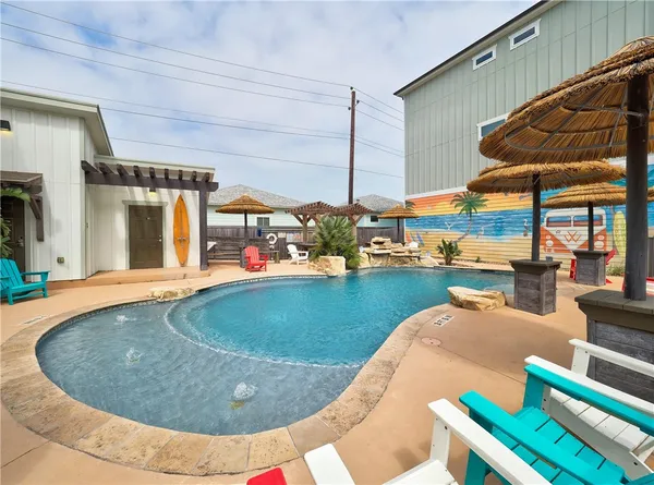 a view of swimming pool with outdoor seating