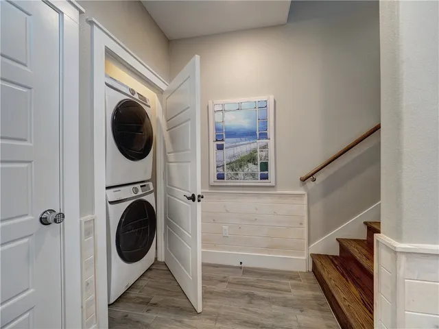 a view of a hallway with washer and dryer