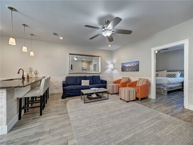 a bed room with furniture and a flat screen tv