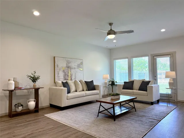 a table with a stove and white cabinets
