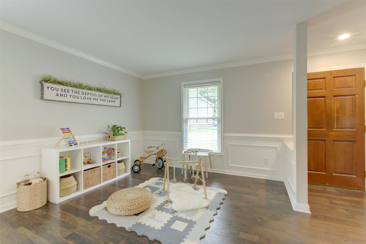 5516 Banwell Place Raleigh, NC 27613 - Photo 4 of 30 Open Living Room area full of possibilities for uses! Notice lovely molding. Open Living/Dining Room Area
