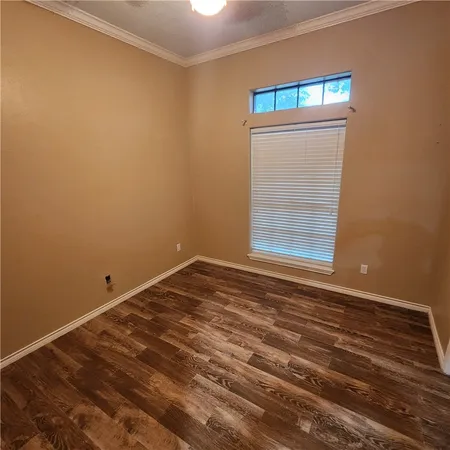 a bathroom with a granite countertop sink a mirror and a bathtub