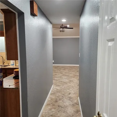 a bathroom with a granite countertop sink a mirror and a shower