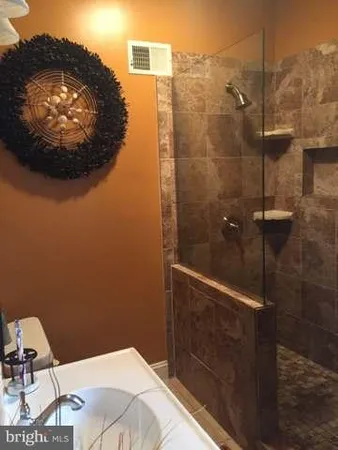 a bathroom with a toilet and a vanity