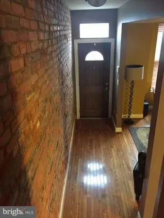 a view of gallery with wooden floor