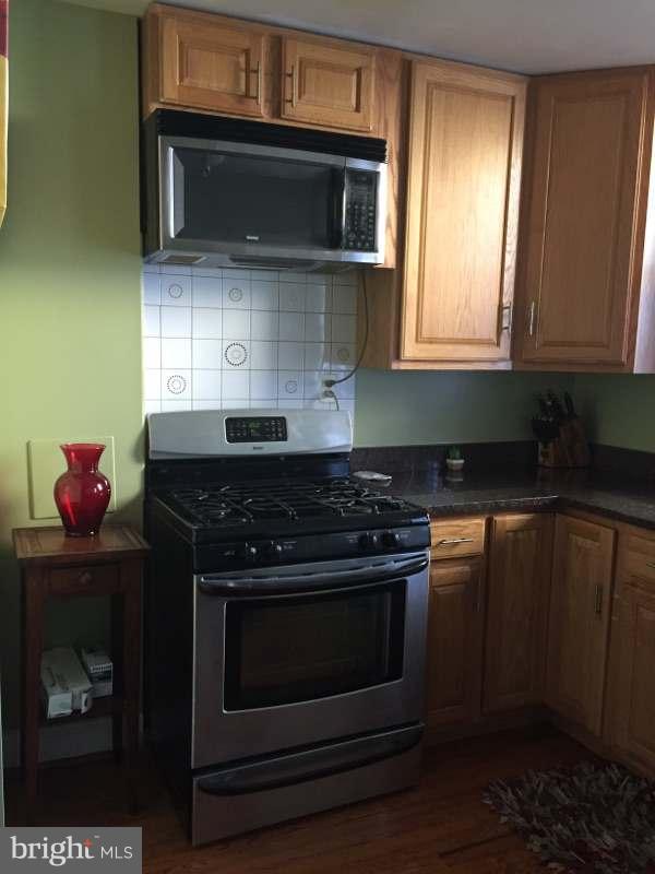 820 K Street Northeast Washington, DC 20002 - Photo 6 of 14 a stove top oven sitting inside of a kitchen