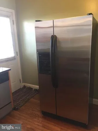 a bathroom with a glass door shower