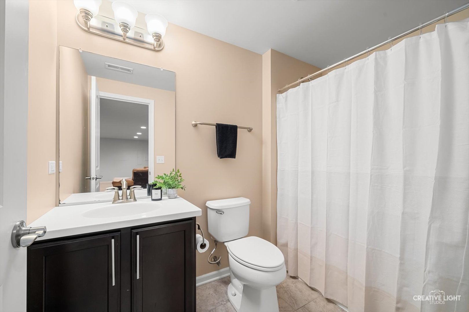 5332 Cedar Drive Naperville, IL 60564 - Photo 15 of 56 a bathroom with a sink vanity mirror and toilet