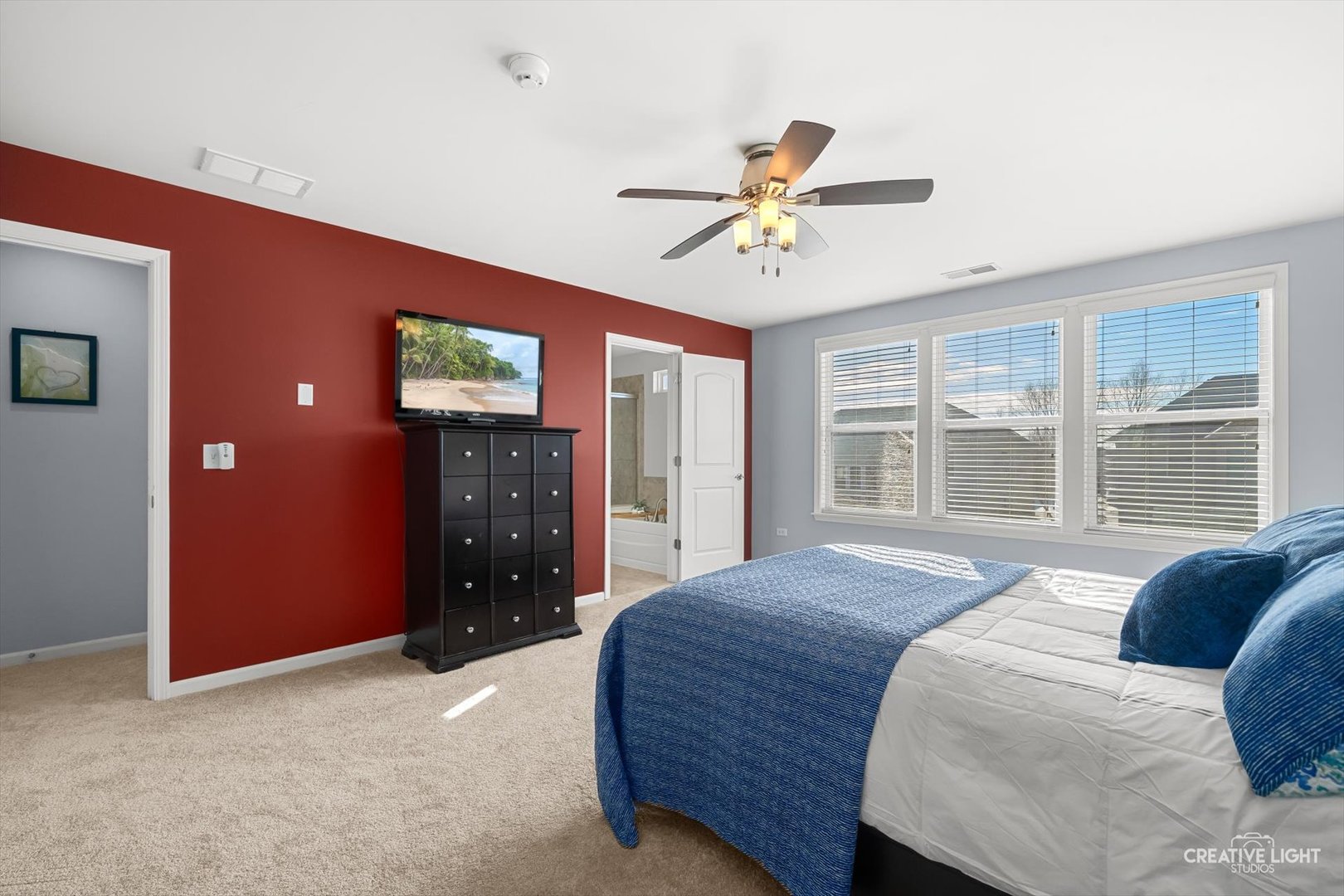 5332 Cedar Drive Naperville, IL 60564 - Photo 17 of 56 a bedroom with a bed ceiling fan and window