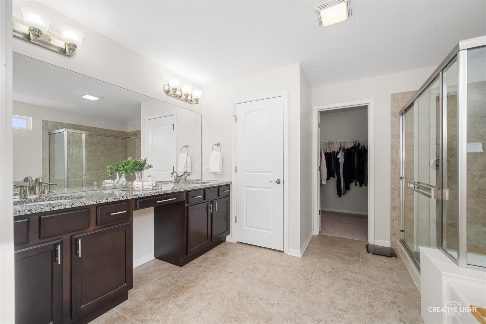 5332 Cedar Drive Naperville, IL 60564 - Photo 18 of 56 a large bathroom with a granite countertop double vanity sink and mirror