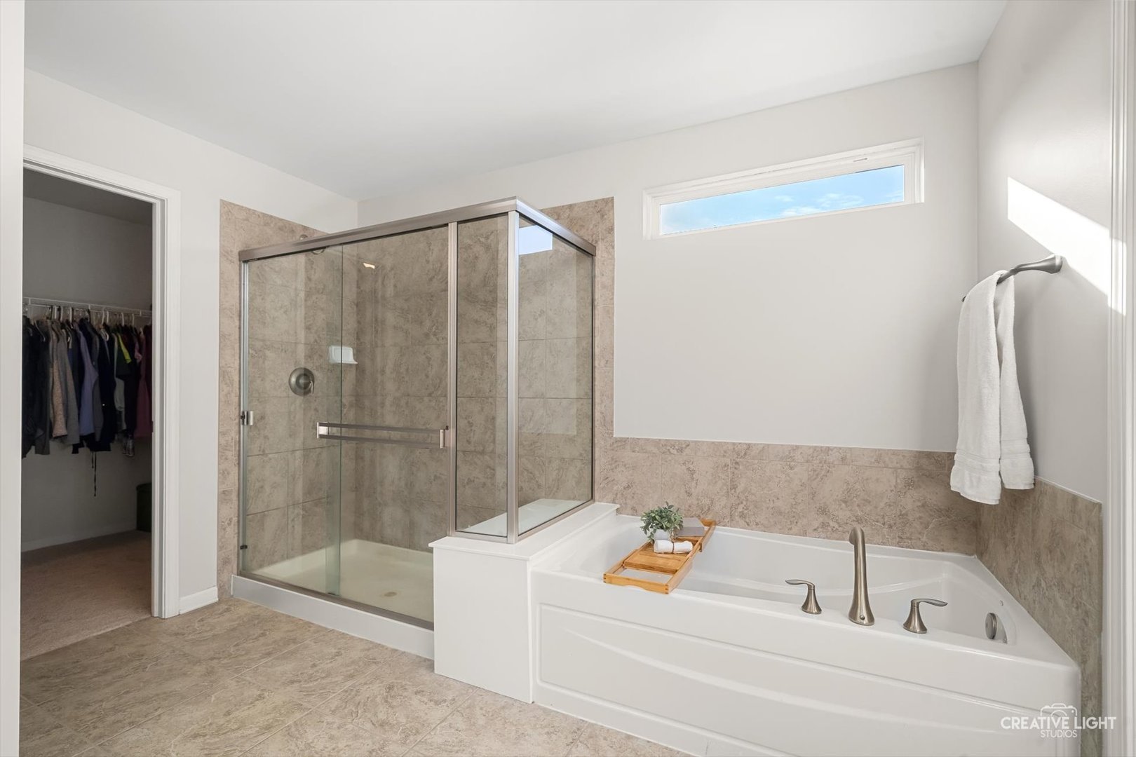 5332 Cedar Drive Naperville, IL 60564 - Photo 19 of 56 a bathroom with a bathtub and a shower
