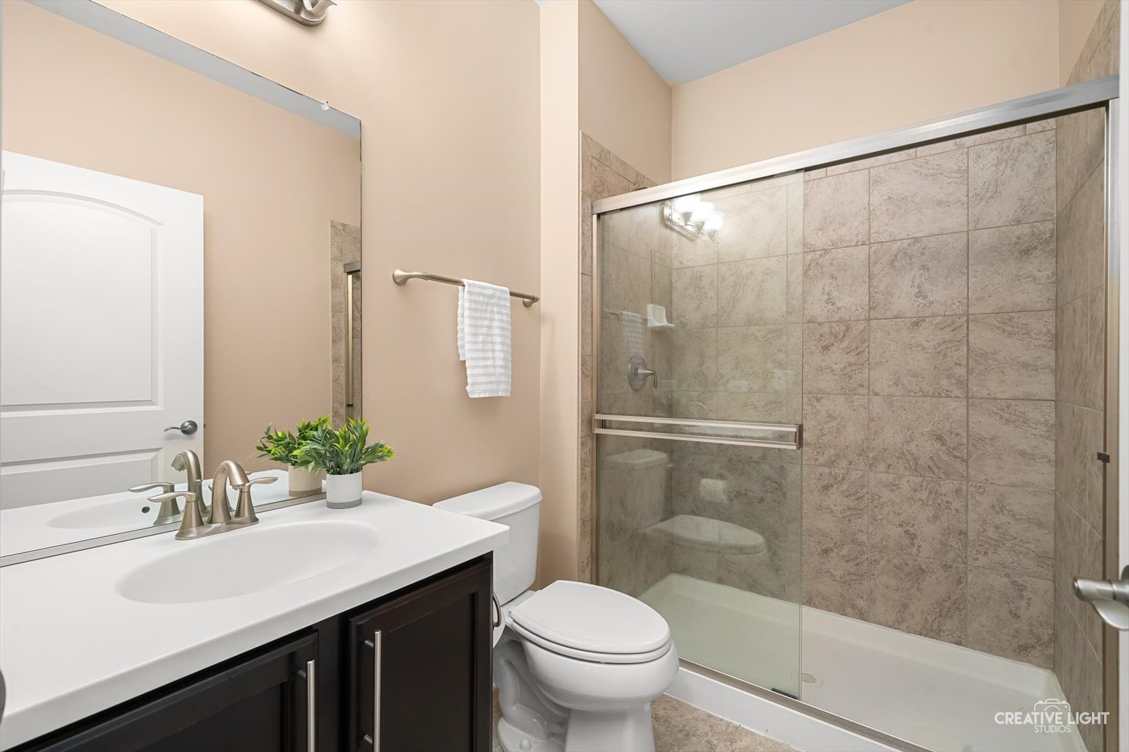 5332 Cedar Drive Naperville, IL 60564 - Photo 21 of 56 a bathroom with a sink toilet and shower