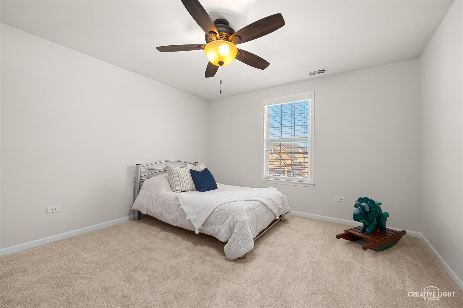 5332 Cedar Drive Naperville, IL 60564 - Photo 25 of 56 a bed room with a bed and a chandelier