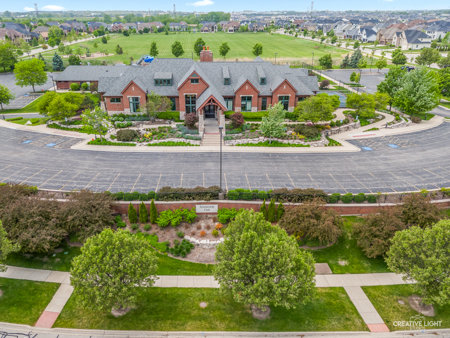 5332 Cedar Drive Naperville, IL 60564 - Photo 45 of 56 an aerial view of a house with a garden and a swimming pool