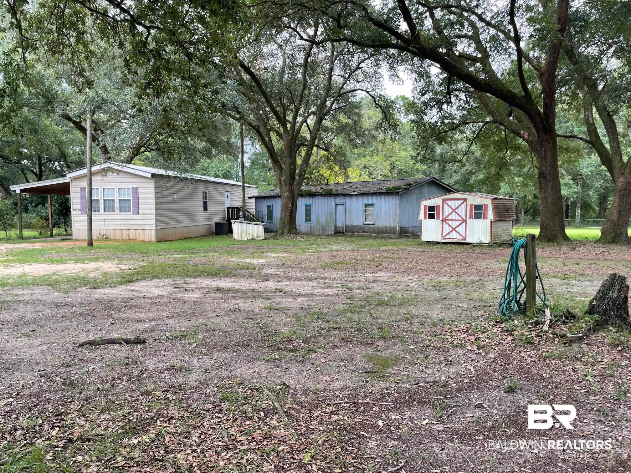 15338 Windbigler Drive Foley, AL 36535 - Photo 21 of 28 Exterior space featuring a storage shed