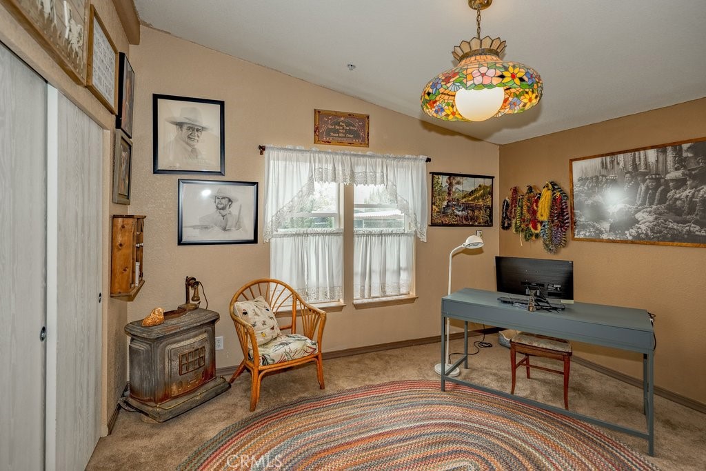 33330 Palen Road Agua Dulce, CA 91390 - Photo 20 of 56 a living room with furniture a flat screen tv and a table