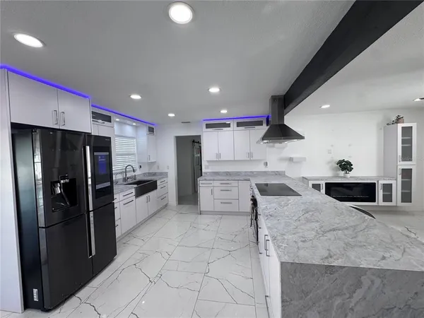 a bathroom with a double vanity sink toilet and shower
