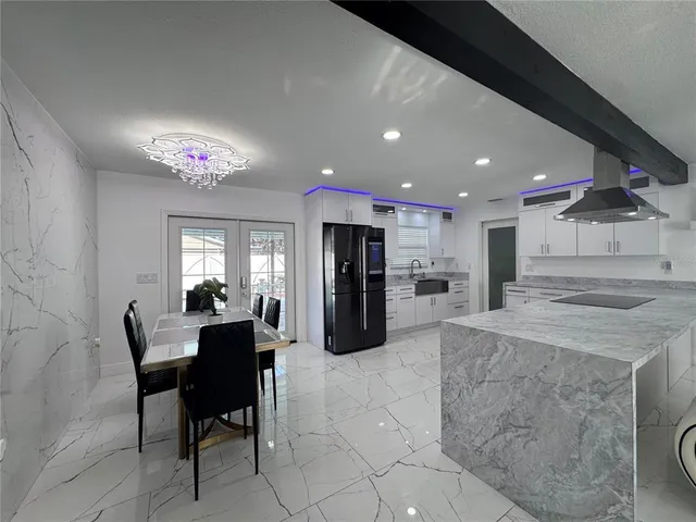 a bathroom with a glass shower door