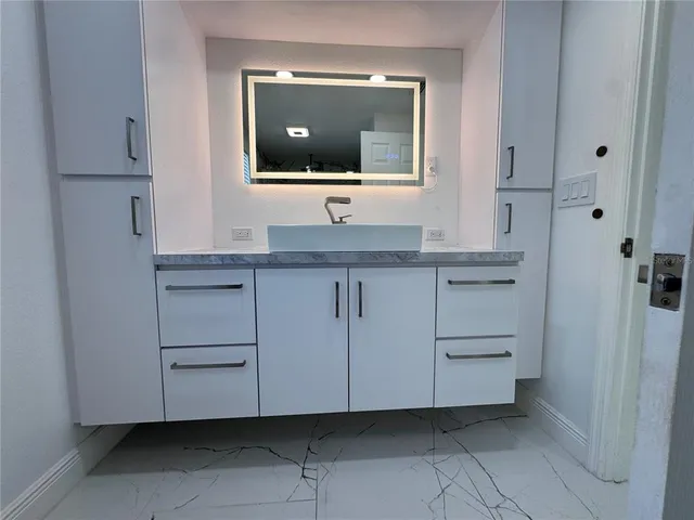 an aerial view of houses with outdoor space