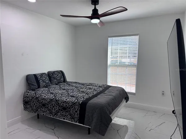 a view of a ceiling fan in a room