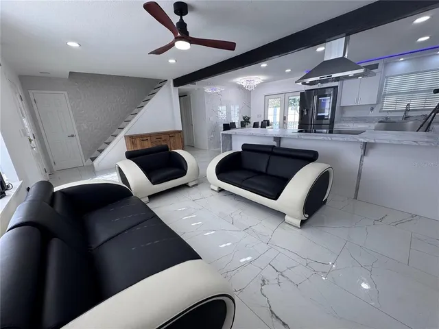 a kitchen with granite countertop a stove and a sink