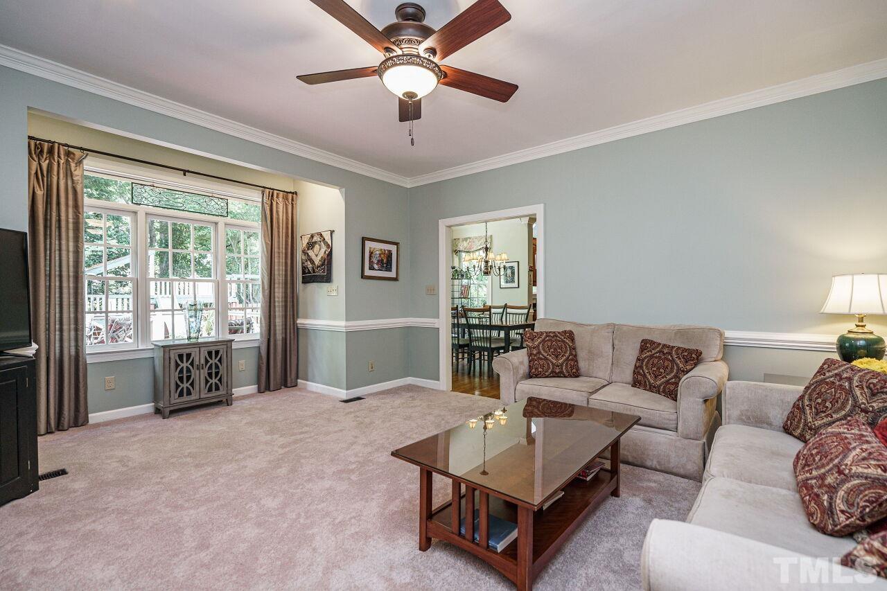 8601 Zinfandel Place Raleigh, NC 27615 - Photo 12 of 29 a living room with furniture and a large window