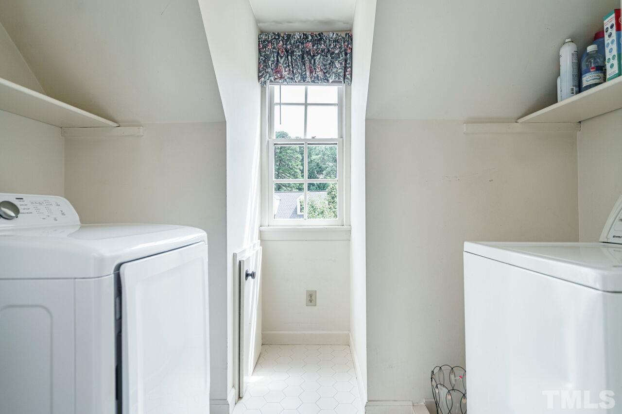8601 Zinfandel Place Raleigh, NC 27615 - Photo 22 of 29 a utility room with dryer and washer