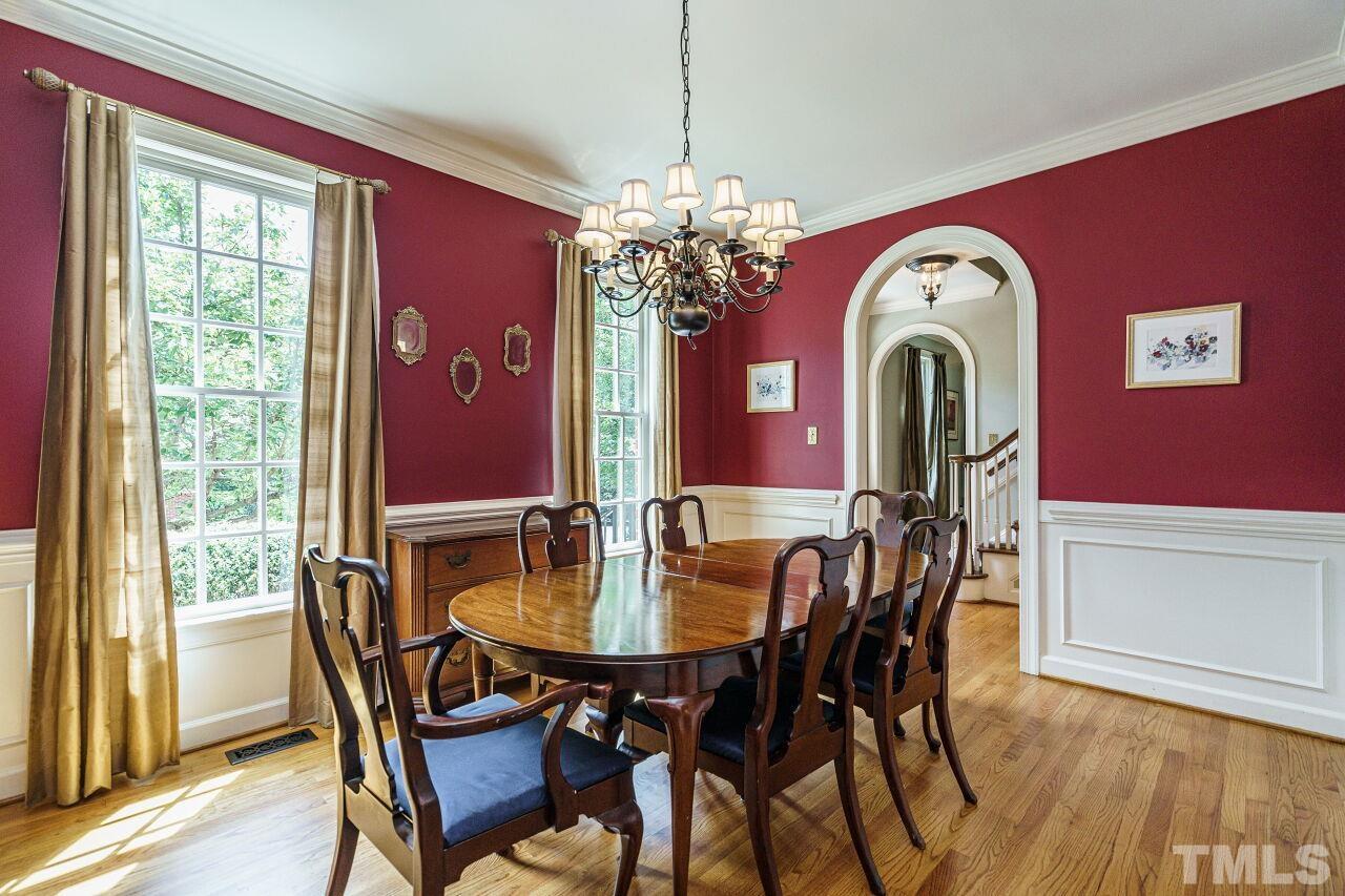 8601 Zinfandel Place Raleigh, NC 27615 - Photo 5 of 29 a view of a dining room with furniture window and wooden floor