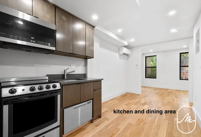 a kitchen with a stove and a microwave