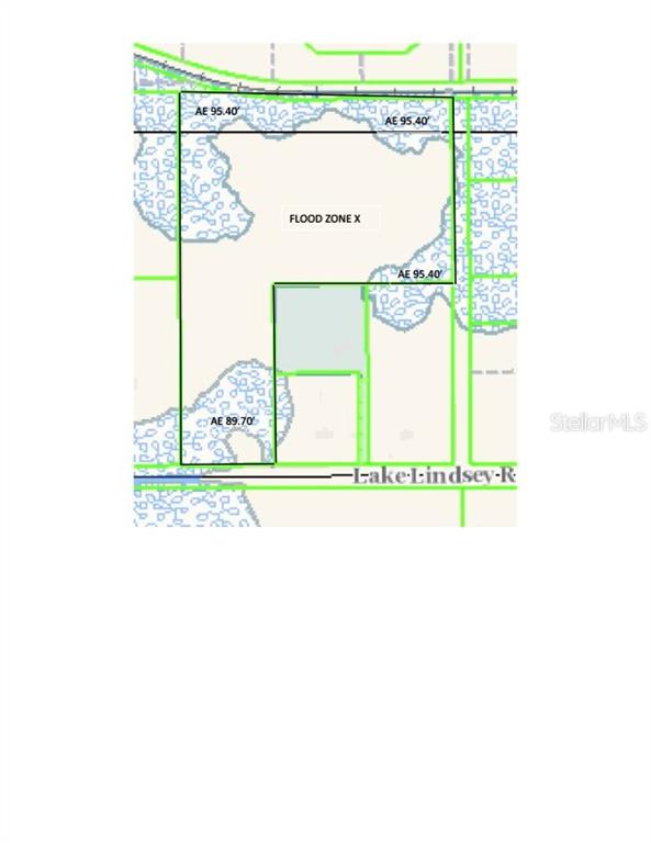 Lake Lindsey Road Brooksville, FL 34601 - Photo 16 of 34 a picture of a book and a white bed