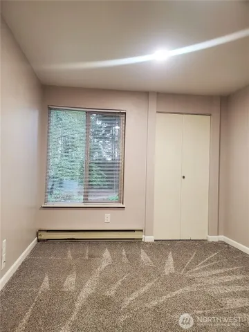 a view of a room that has a window in it