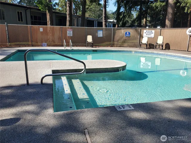 a view of outdoor space swimming pool and outdoor seating