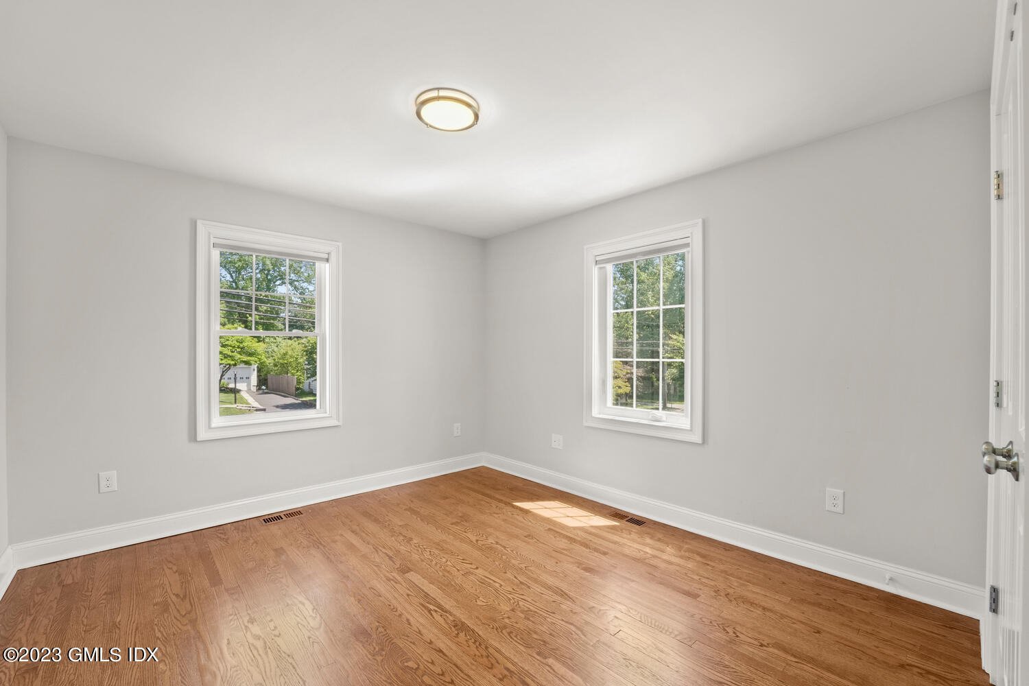 36 Sheep Hill Road Riverside, CT 06878 - Photo 13 of 37 a view of an empty room with wooden floor and a window