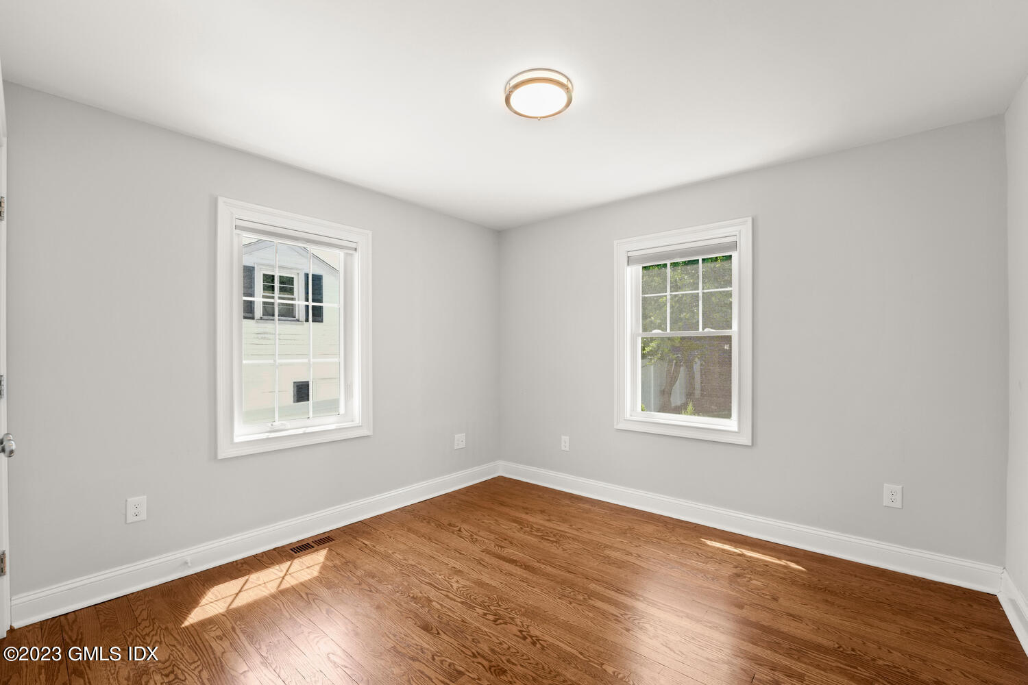 36 Sheep Hill Road Riverside, CT 06878 - Photo 15 of 37 a view of an empty room with wooden floor and a window