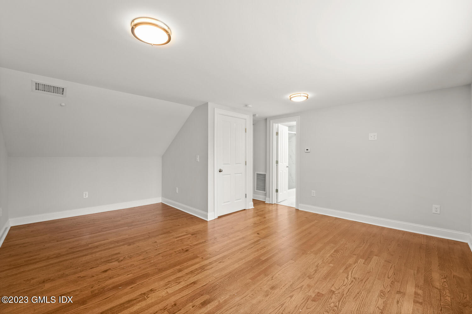 36 Sheep Hill Road Riverside, CT 06878 - Photo 18 of 37 a view of an empty room with wooden floor