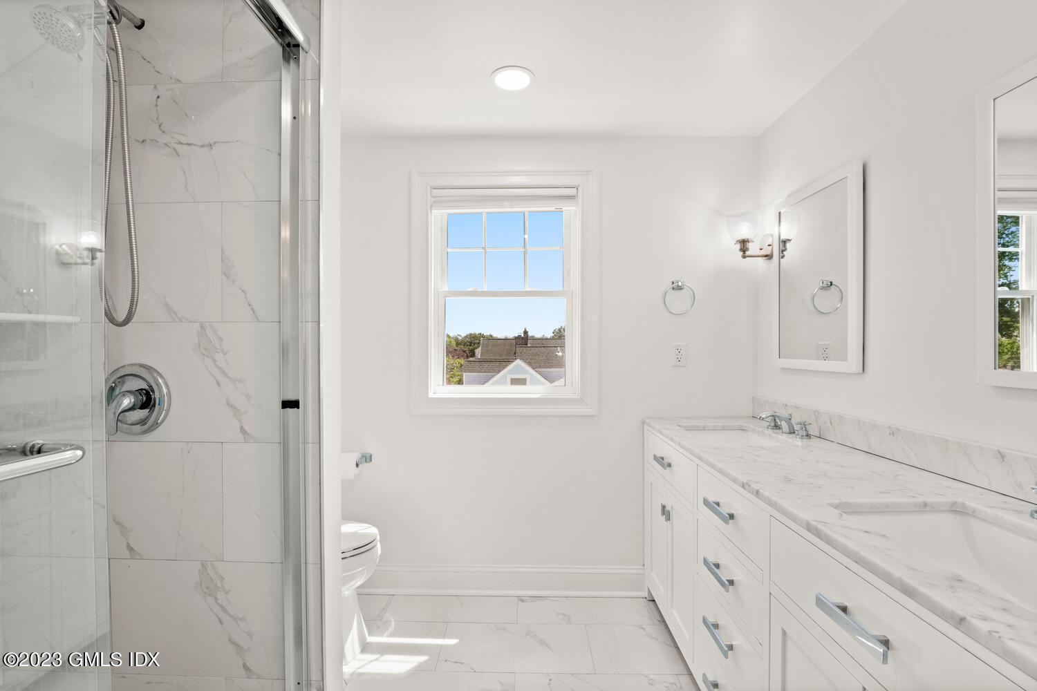 36 Sheep Hill Road Riverside, CT 06878 - Photo 21 of 37 a bathroom with a granite countertop sink a mirror and a shower