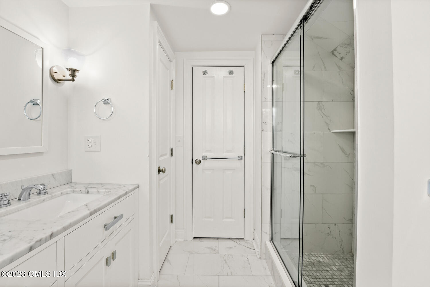 36 Sheep Hill Road Riverside, CT 06878 - Photo 22 of 37 a spacious bathroom with a granite countertop sink a mirror and a shower