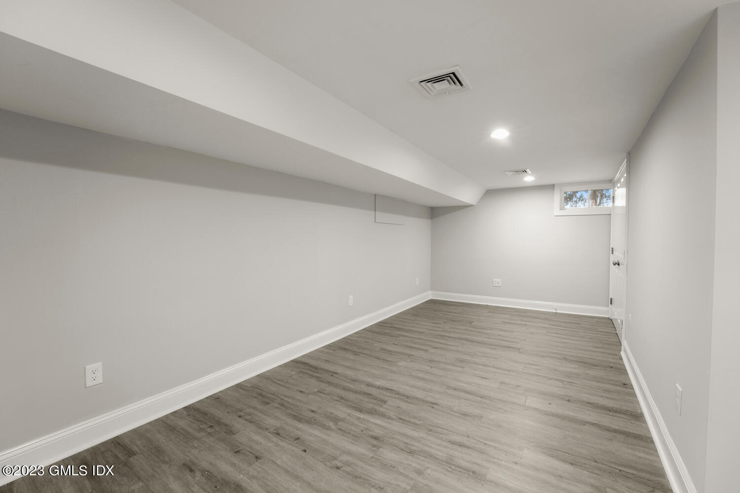 36 Sheep Hill Road Riverside, CT 06878 - Photo 28 of 37 a view of an empty room with wooden floor and a window