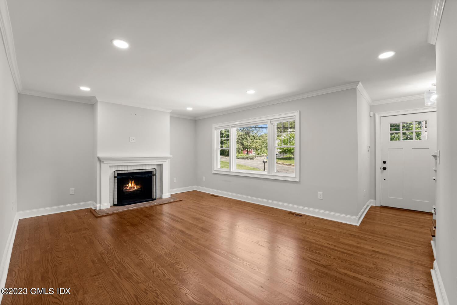 36 Sheep Hill Road Riverside, CT 06878 - Photo 3 of 37 an empty room with wooden floor fireplace and windows