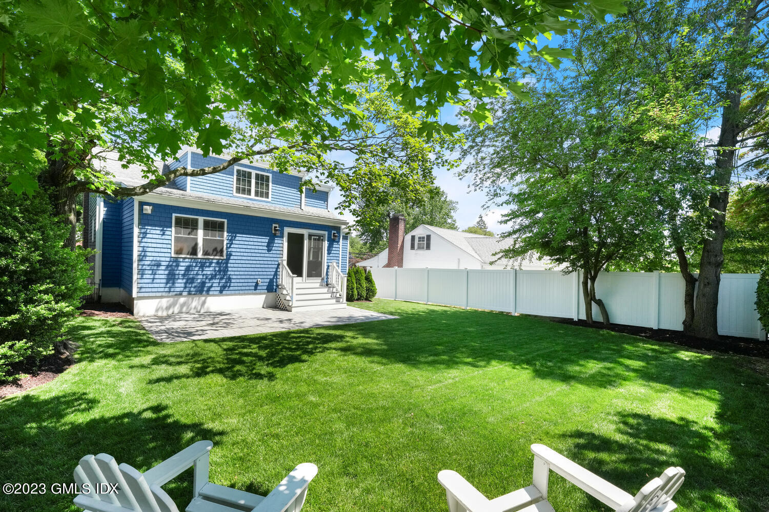 36 Sheep Hill Road Riverside, CT 06878 - Photo 31 of 37 a front view of a house with a yard and green space