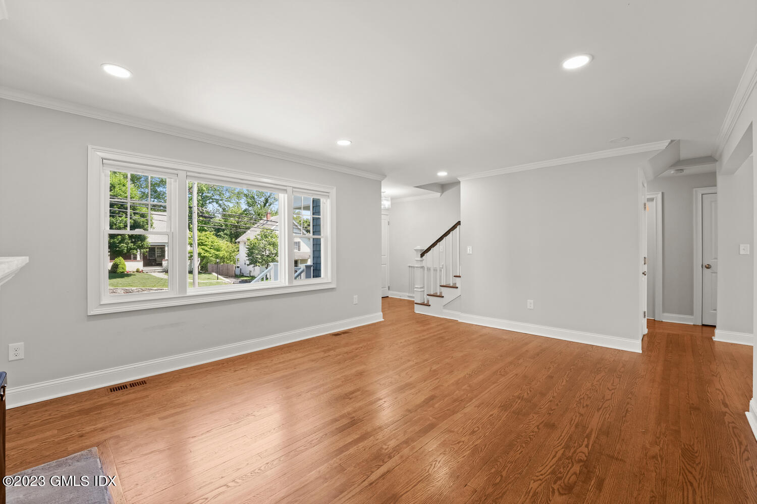 36 Sheep Hill Road Riverside, CT 06878 - Photo 4 of 37 an empty room with wooden floor and windows