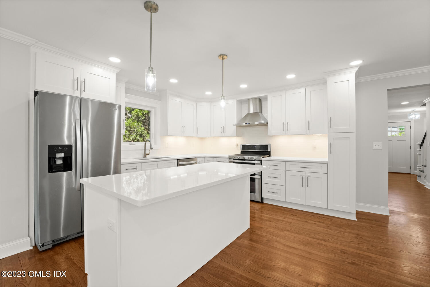 36 Sheep Hill Road Riverside, CT 06878 - Photo 8 of 37 a kitchen with white cabinets and stainless steel appliances