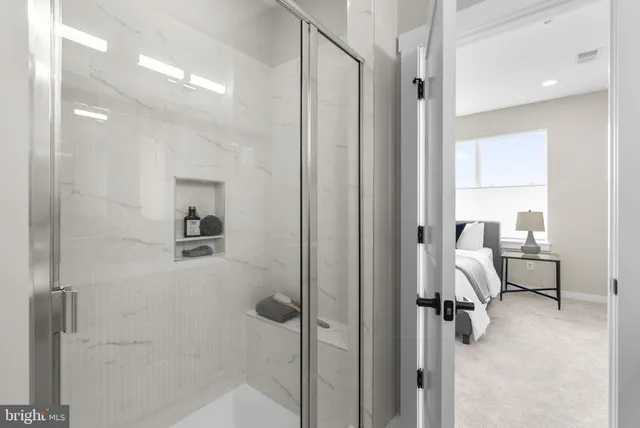 a bathroom with a sink vanity granite and a toilet
