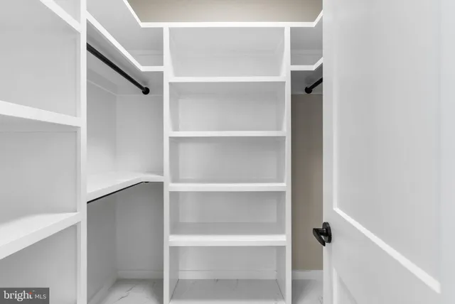 a bathroom with a tub and a shower