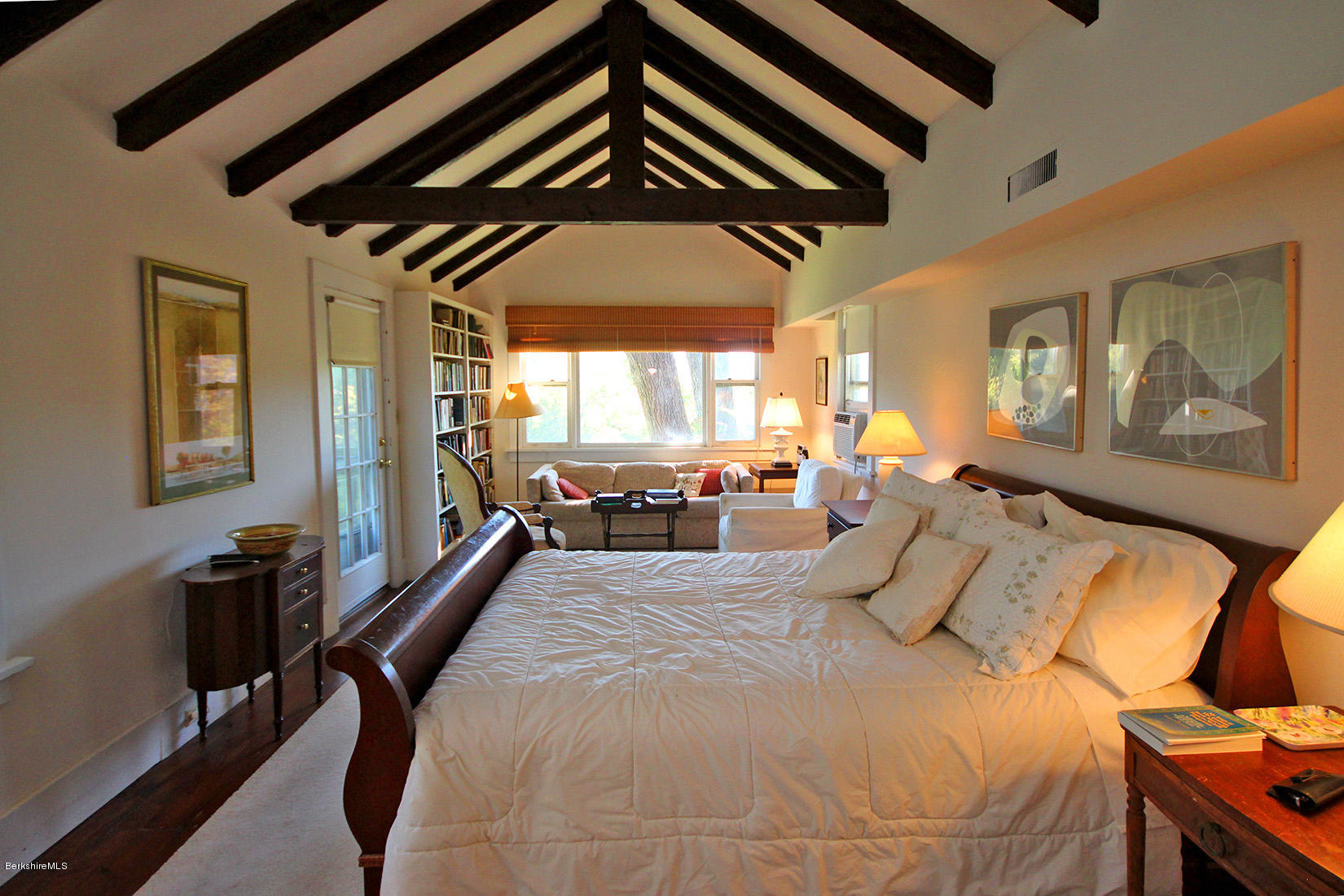 20 Main Street Stockbridge, MA 01262 - Photo 11 of 40 a bed room with a bed and a painting on the wall