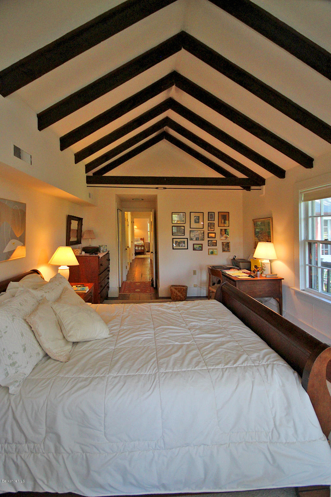 20 Main Street Stockbridge, MA 01262 - Photo 13 of 40 a bedroom with a bed and a chandelier