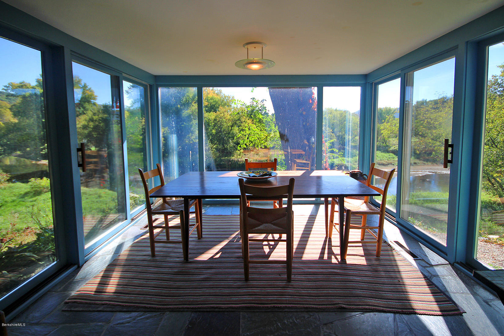 20 Main Street Stockbridge, MA 01262 - Photo 16 of 40 a view of a dining room with furniture and window