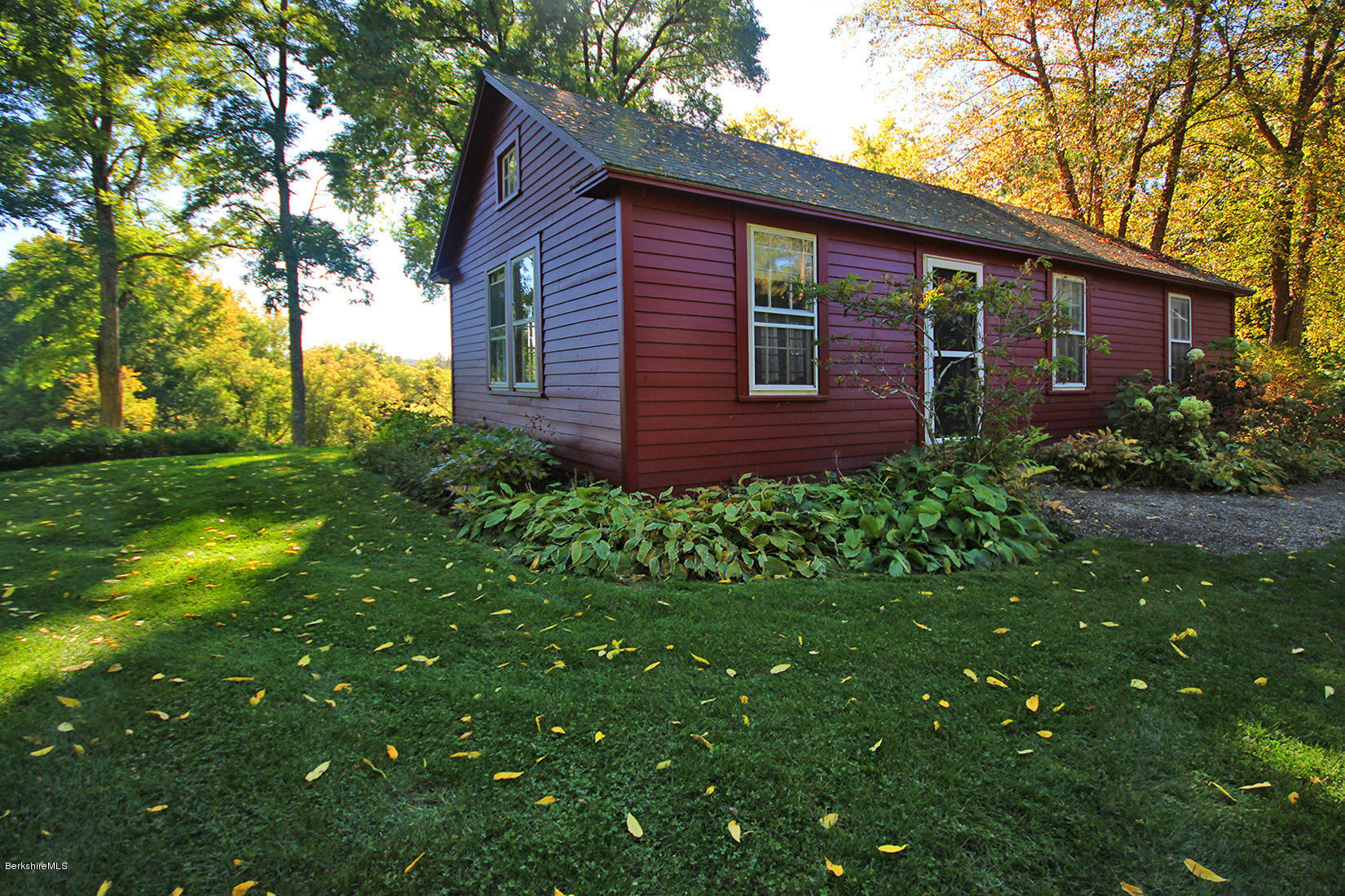 20 Main Street Stockbridge, MA 01262 - Photo 25 of 40 a view of a backyard with plants and large tree