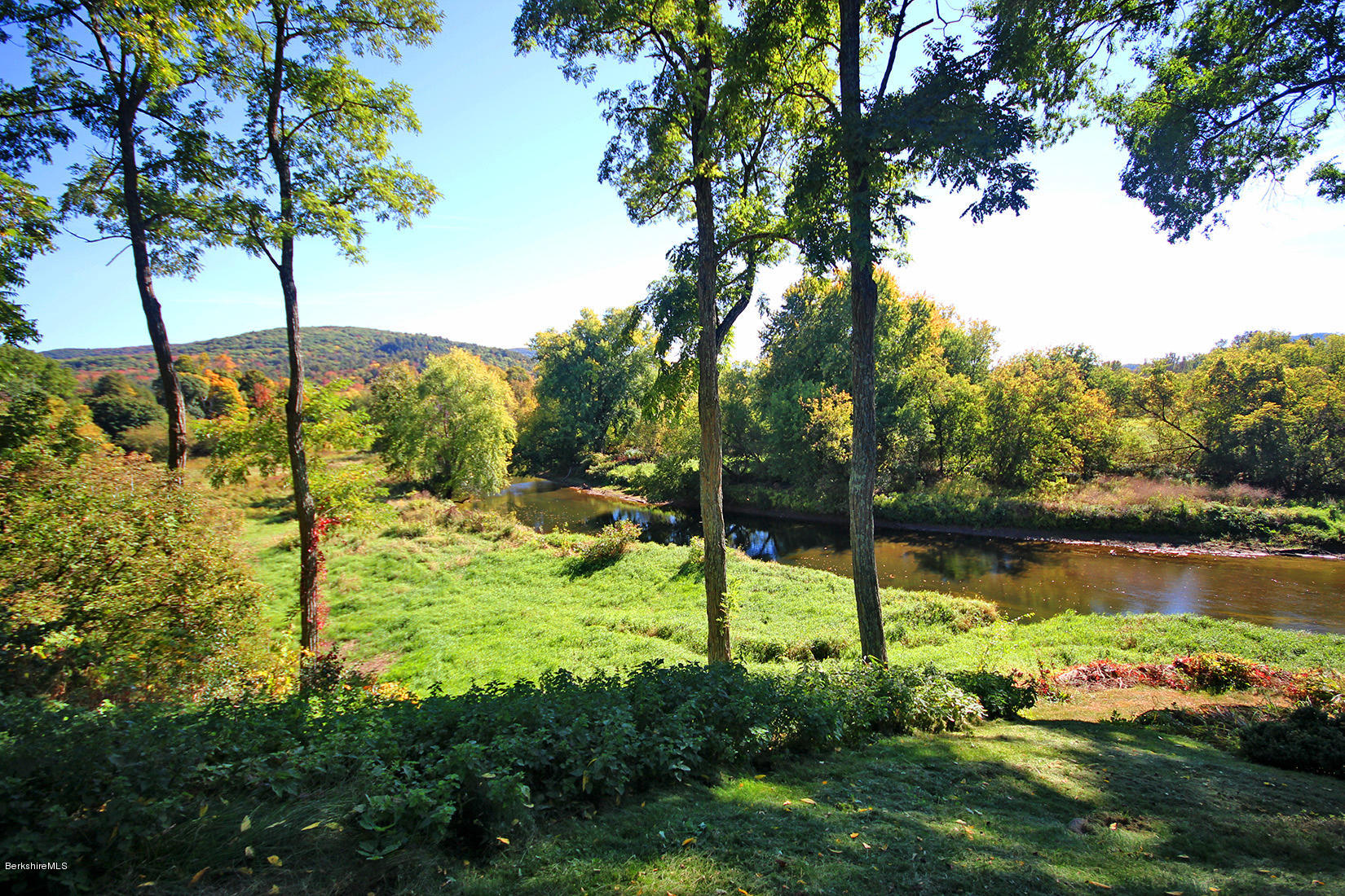 20 Main Street Stockbridge, MA 01262 - Photo 4 of 40 a view of a lake with a yard